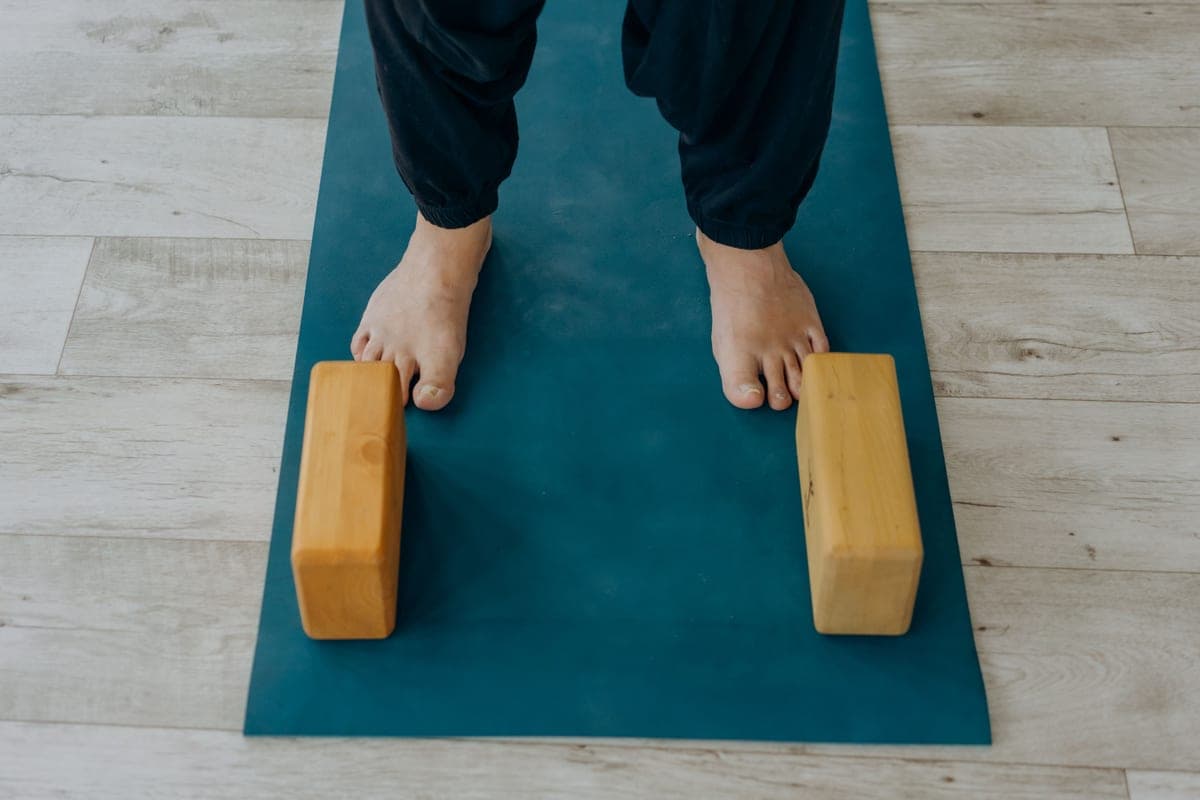 Stock photo: wooden blocks on an indoor floor next to a mat
