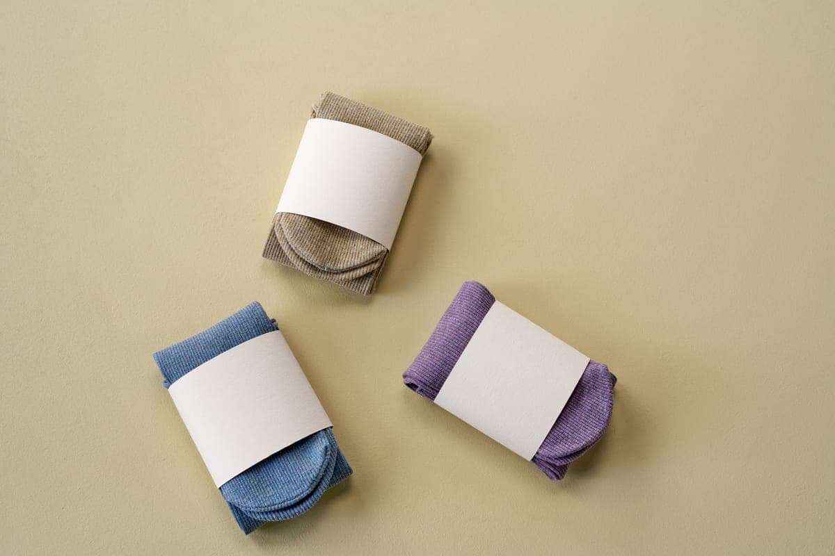 Stock photo: three pairs of folded socks arranged on a plain background