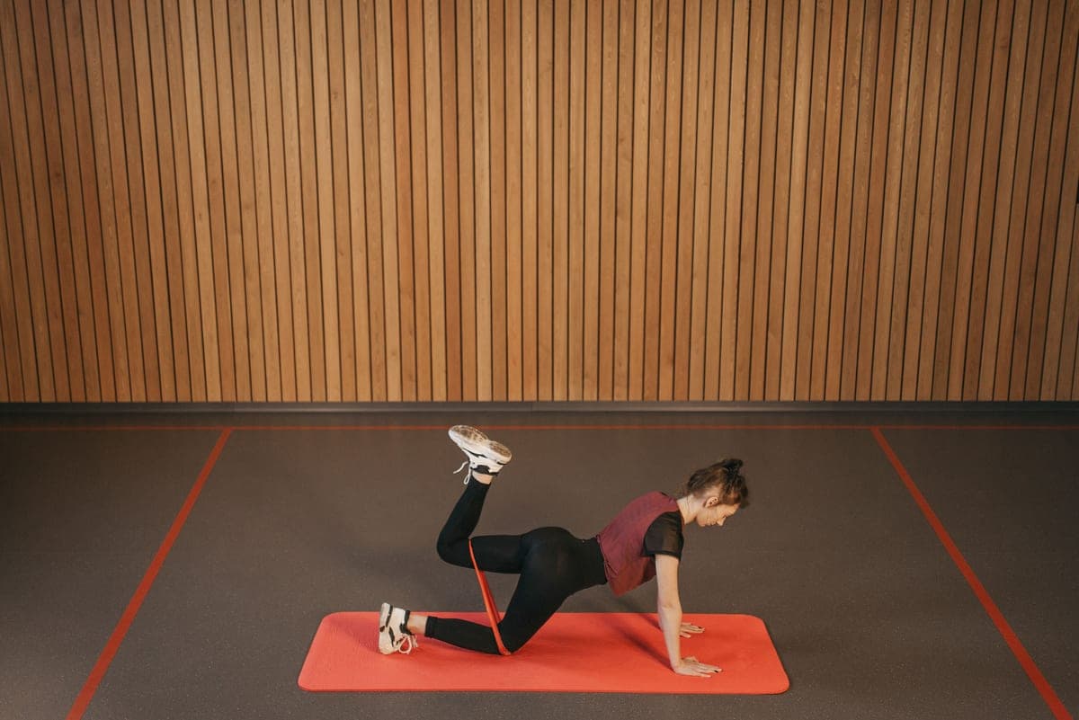 Stock photo: a resistance-band exercise on a mat indoors